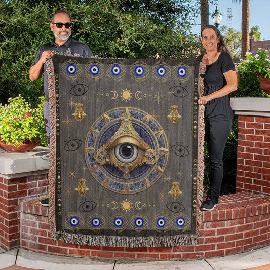 Experience the melding of comfort and mystique with our Evil Eye Woven Blanket. It's not just a blanket; it's a statement piece that invites positivity and style into your living space. Wrap yourself in the soothing energy of ancient symbolism!